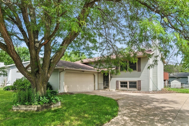 507 17 1/2 St SE, Rochester, MN 55904 - view of front facade with concrete driveway, a garage, and a chimney