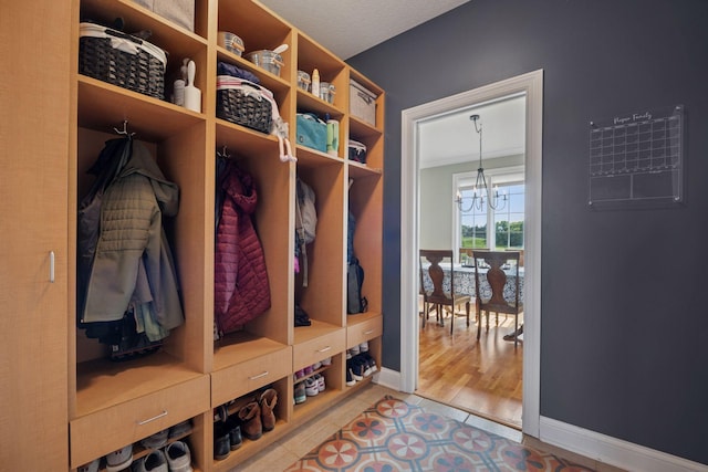 11540 Eckert Ave SE, Franklin Twp, MN 55328 - mudroom with a chandelier and tile patterned flooring