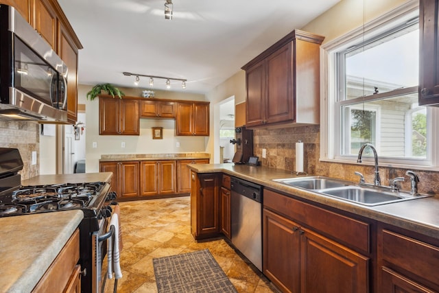 6342 Baker Ave NE, Fridley, MN 55432 - kitchen featuring appliances with stainless steel finishes and tasteful backsplash