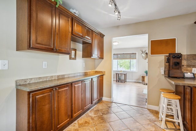 6342 Baker Ave NE, Fridley, MN 55432 - kitchen with brown cabinets and track lighting