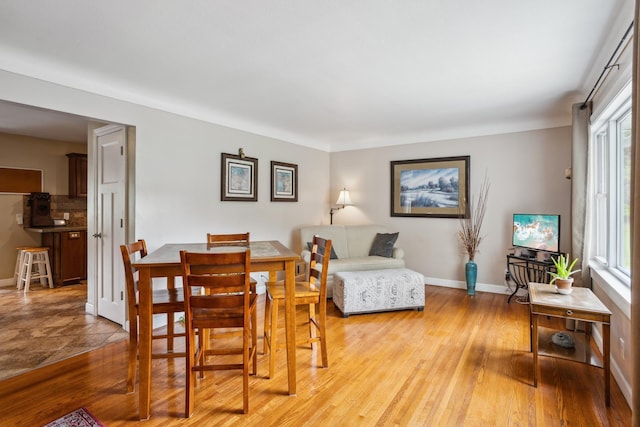6342 Baker Ave NE, Fridley, MN 55432 - dining space with plenty of natural light and light wood-style floors