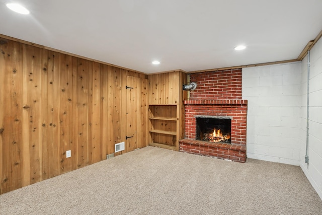 6342 Baker Ave NE, Fridley, MN 55432 - unfurnished living room with carpet flooring, a fireplace, recessed lighting, and wooden walls