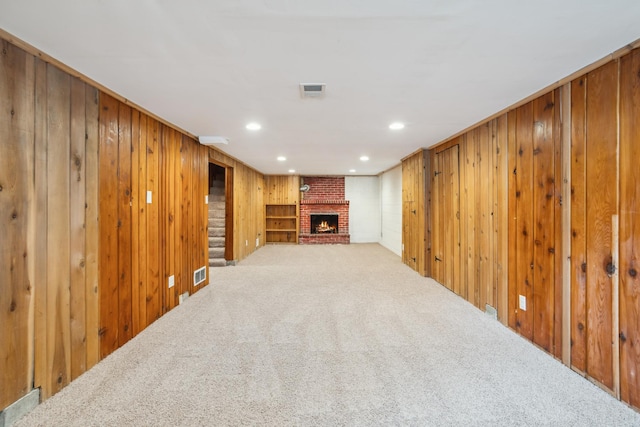 6342 Baker Ave NE, Fridley, MN 55432 - finished basement featuring carpet, wood walls, a brick fireplace, and recessed lighting