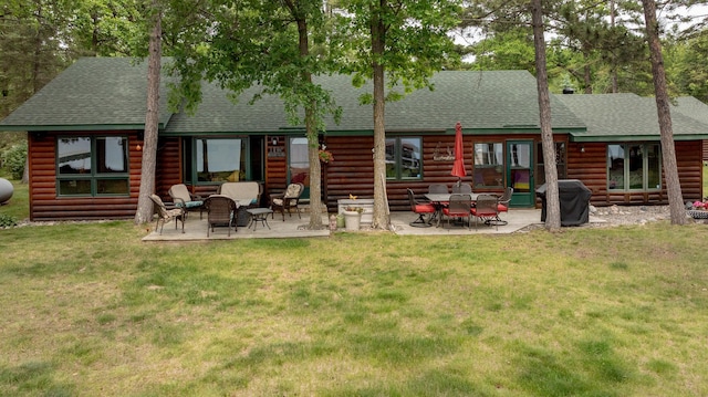 35139 County 39, Laporte, MN 56461 - rear view of house with a shingled roof, a patio area, and a yard