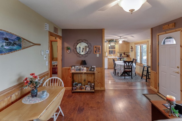 35139 County 39, Laporte, MN 56461 - dining space with a ceiling fan, wood finished floors, and wainscoting