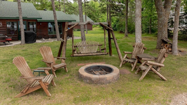 35139 County 39, Laporte, MN 56461 - view of grassy yard with a fire pit and a patio area