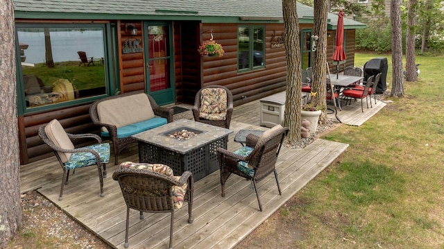 35139 County 39, Laporte, MN 56461 - wooden terrace with a fire pit, outdoor dining area, and a yard