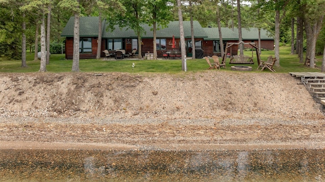 35139 County 39, Laporte, MN 56461 - view of green lawn featuring a fire pit and a patio