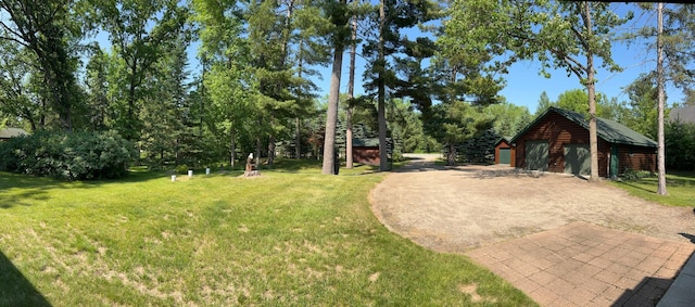 35139 County 39, Laporte, MN 56461 - view of green lawn featuring an outdoor structure and a garage