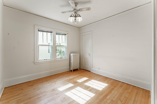 1787 Randolph Ave, Saint Paul, MN 55105 - spare room with radiator heating unit, hardwood / wood-style flooring, and a ceiling fan