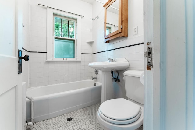 1787 Randolph Ave, Saint Paul, MN 55105 - bathroom with tile walls, tile patterned flooring, and bathing tub / shower combination