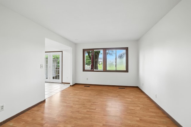 2544 Copper Cliff Trl, Woodbury, MN 55125 - spare room featuring light wood finished floors and baseboards