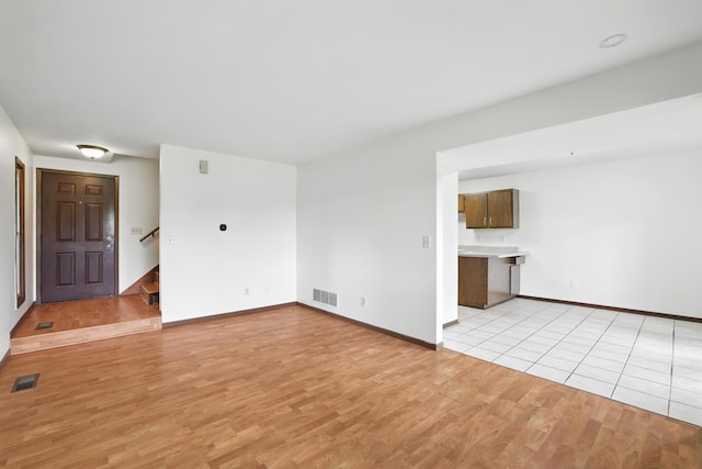 2544 Copper Cliff Trl, Woodbury, MN 55125 - unfurnished living room featuring light wood-style floors and stairs