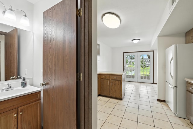 2544 Copper Cliff Trl, Woodbury, MN 55125 - bathroom with vanity, tile patterned floors, and french doors