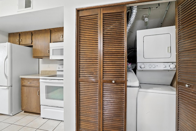 2544 Copper Cliff Trl, Woodbury, MN 55125 - laundry area with stacked washer / drying machine and light tile patterned flooring