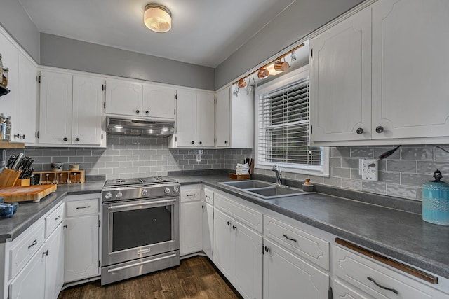 212 30th Ave N, Saint Cloud, MN 56303 - kitchen featuring gas range, dark countertops, white cabinetry, under cabinet range hood, and dark wood-style floors