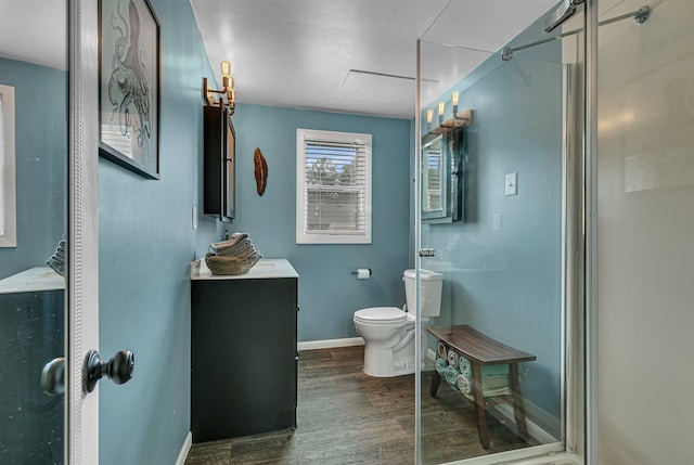 212 30th Ave N, Saint Cloud, MN 56303 - bathroom with wood finished floors, a stall shower, and vanity