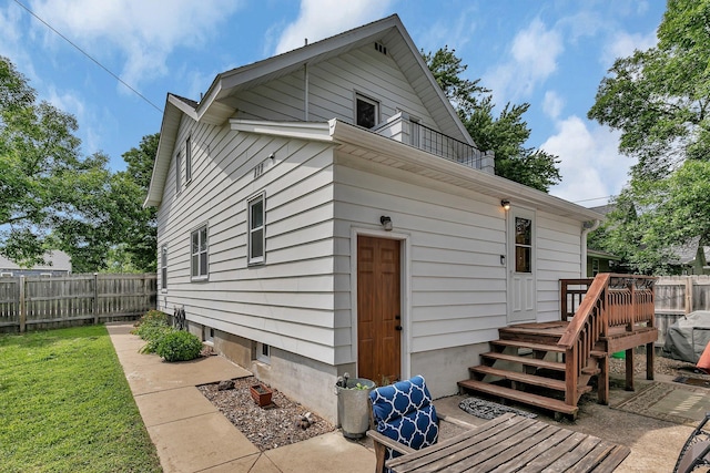 212 30th Ave N, Saint Cloud, MN 56303 - back of property with a deck and a balcony