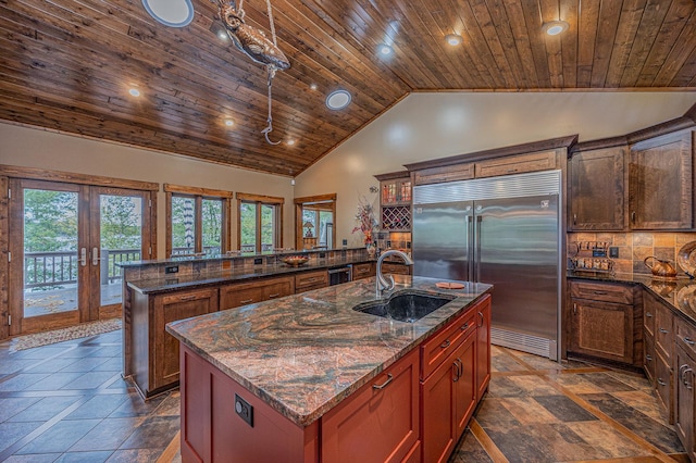 1116 Sand Lake Dr NW, Backus, MN 56435 - kitchen with built in fridge, wood ceiling, a center island with sink, french doors, and a peninsula