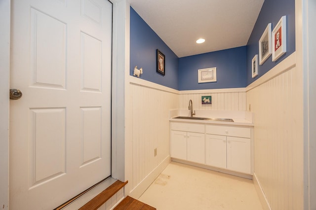 1116 Sand Lake Dr NW, Backus, MN 56435 - bathroom featuring a wainscoted wall and a sink