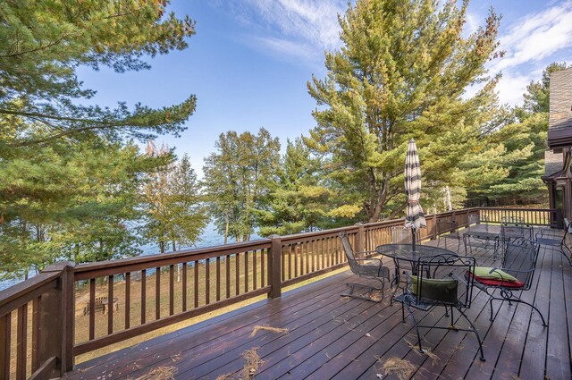 1116 Sand Lake Dr NW, Backus, MN 56435 - wooden deck with outdoor dining area