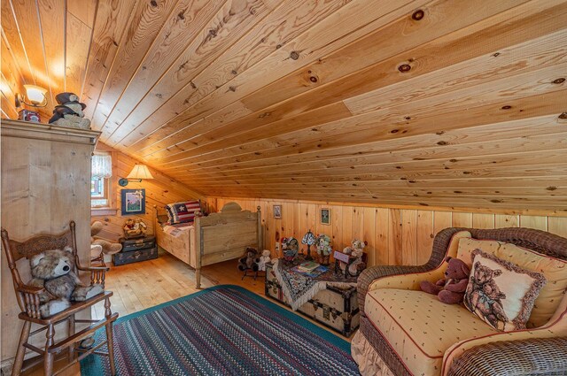 1116 Sand Lake Dr NW, Backus, MN 56435 - bedroom with wooden ceiling, wooden walls, vaulted ceiling, and wood-type flooring
