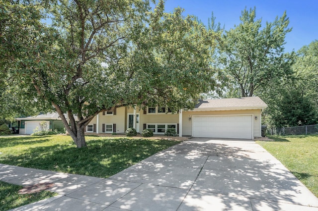 4909 98th St, Bloomington, MN 55437 - view of front facade with driveway and a garage