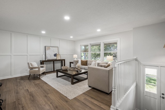 4909 98th St, Bloomington, MN 55437 - living room with a decorative wall, dark wood-style flooring, and recessed lighting