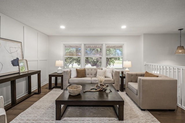 4909 98th St, Bloomington, MN 55437 - living room with dark wood-style floors, recessed lighting, and a textured ceiling