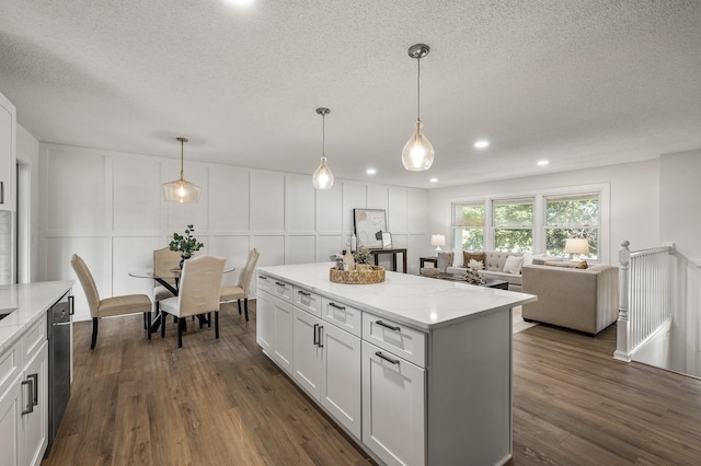 4909 98th St, Bloomington, MN 55437 - kitchen with a decorative wall, a textured ceiling, dark wood-style flooring, white cabinets, and dishwasher
