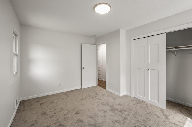 4909 98th St, Bloomington, MN 55437 - unfurnished bedroom featuring carpet flooring and a closet