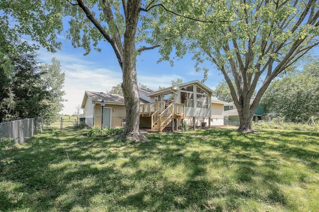 4909 98th St, Bloomington, MN 55437 - back of house featuring stairs, a wooden deck, a sunroom, and a gate