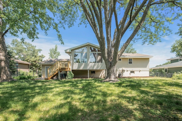 4909 98th St, Bloomington, MN 55437 - rear view of house featuring stairs, a sunroom, and a wooden deck