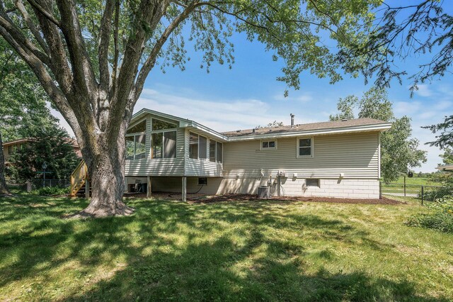 4909 98th St, Bloomington, MN 55437 - back of property featuring a sunroom