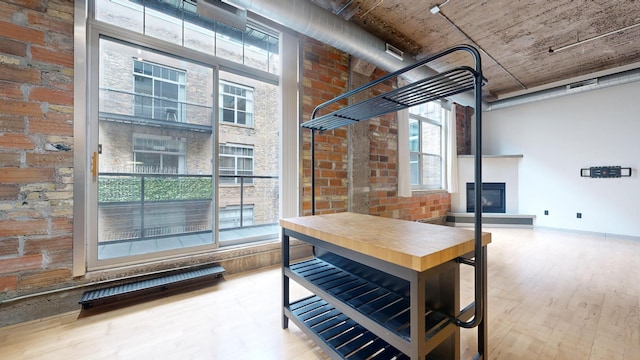 521 7th St Unit 519, Minneapolis, MN 55415 - below grade area with wood finished floors, plenty of natural light, and a glass covered fireplace