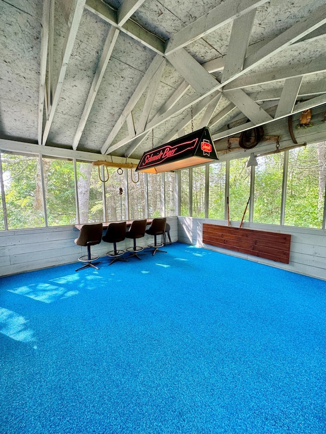 39130 Notebloom Ln, Waubun, MN 56589 - sunroom / solarium featuring vaulted ceiling, carpet floors, and wood walls