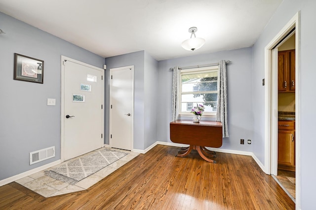 7447 Cleadis Way, Inver Grove Heights, MN 55076 - entryway with wood-type flooring and baseboards