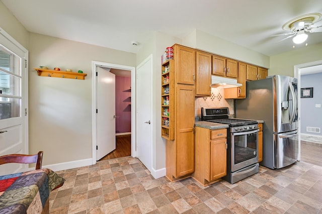 7447 Cleadis Way, Inver Grove Heights, MN 55076 - kitchen with appliances with stainless steel finishes, under cabinet range hood, open shelves, and stone finish floors