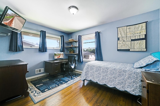 7447 Cleadis Way, Inver Grove Heights, MN 55076 - bedroom featuring wood finished floors, multiple windows, and a desk