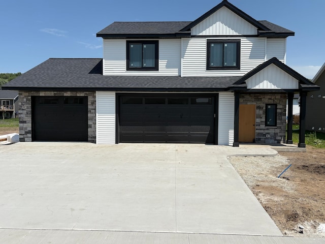 3617 Meadow Sage Ct SE, Rochester, MN 55904 - view of front facade with stone siding, roof with shingles, concrete driveway, and an attached garage
