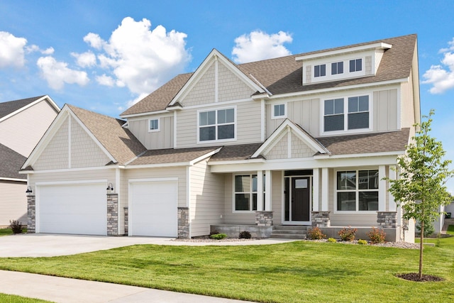 4720 131st Ave NE, Blaine, MN 55449 - craftsman-style home with driveway, board and batten siding, a garage, stone siding, and a front lawn