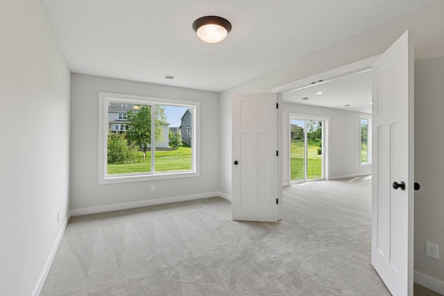 4720 131st Ave NE, Blaine, MN 55449 - carpeted spare room featuring baseboards