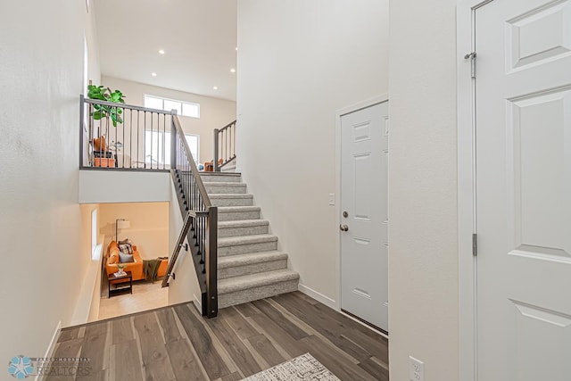 6724 32nd St S, Fargo, ND 58104 - foyer featuring dark wood finished floors, stairs, recessed lighting, and a high ceiling
