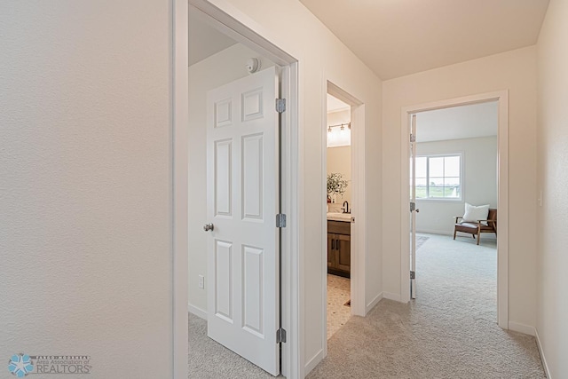 6724 32nd St S, Fargo, ND 58104 - hall with light colored carpet and baseboards
