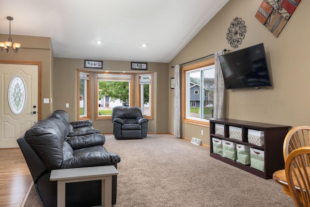 N8343 Mcwain Dr, Holland Twp, WI 54636 - living area with a chandelier, lofted ceiling, carpet floors, and recessed lighting