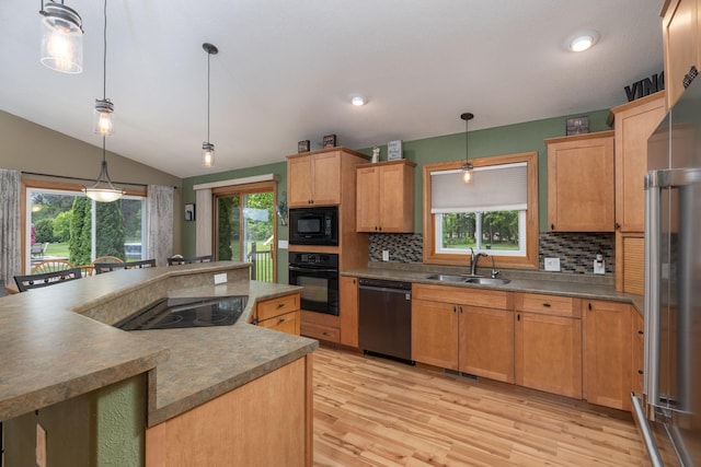 N8343 Mcwain Dr, Holland Twp, WI 54636 - kitchen featuring black appliances, decorative backsplash, healthy amount of natural light, lofted ceiling, and recessed lighting
