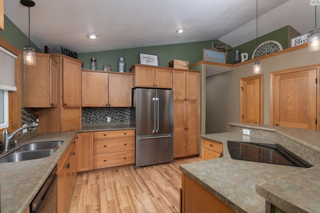 N8343 Mcwain Dr, Holland Twp, WI 54636 - kitchen with black appliances, lofted ceiling, light wood-type flooring, decorative backsplash, and hanging light fixtures