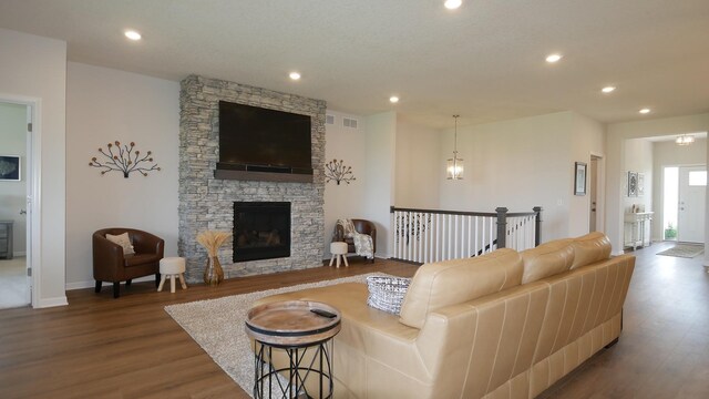 1872 Oakpointe Dr, Waconia, MN 55387 - living room with wood finished floors, recessed lighting, and a stone fireplace