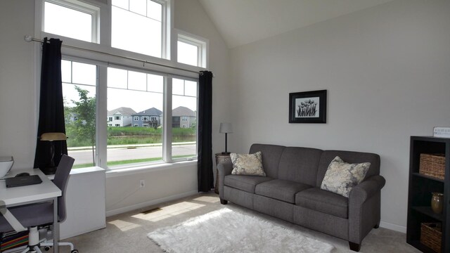 1872 Oakpointe Dr, Waconia, MN 55387 - living area with high vaulted ceiling, light colored carpet, and a desk