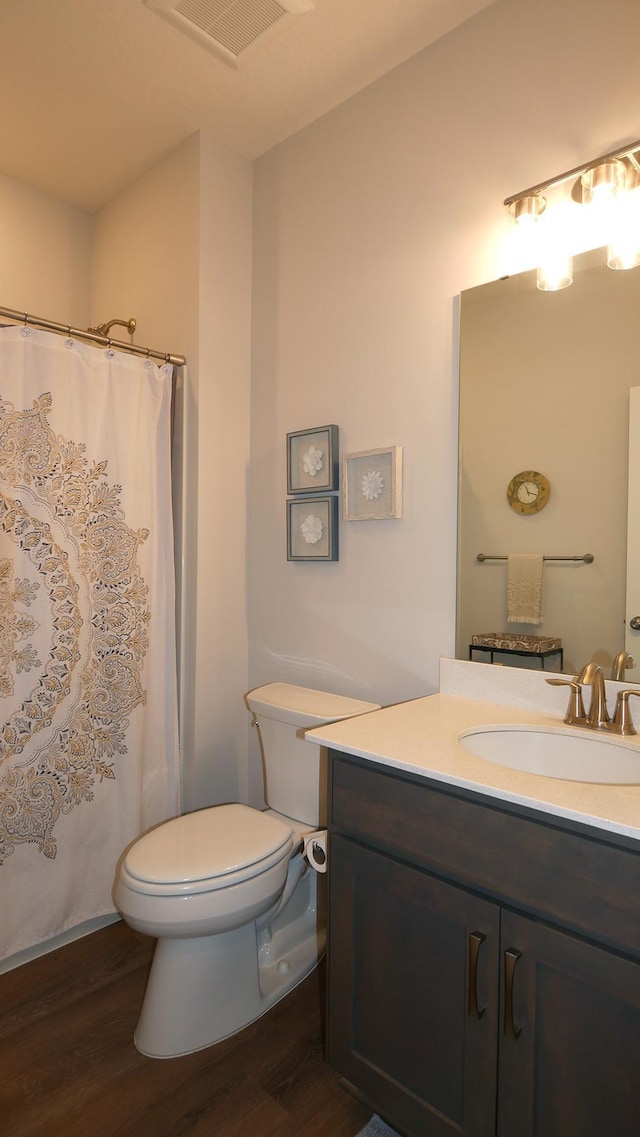 1872 Oakpointe Dr, Waconia, MN 55387 - bathroom with wood finished floors, vanity, and curtained shower